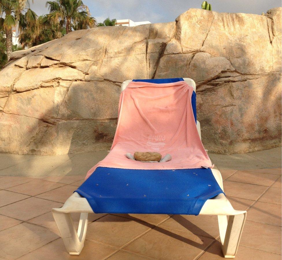 Sun lounger with a towel