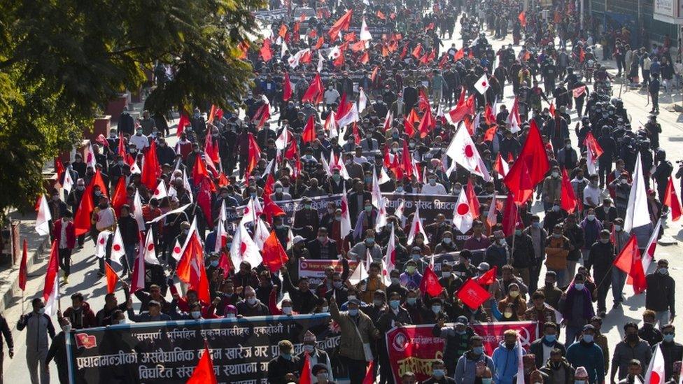 Nepalese Communist activists take a part in a rally against the dissolution of parliament in Kathmandu, Nepal