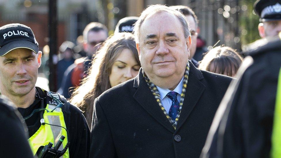 Alex Salmond accompanied by police