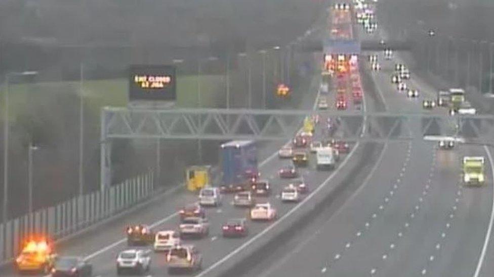 Traffic queuing on the M49 highway as seen on a traffic camera