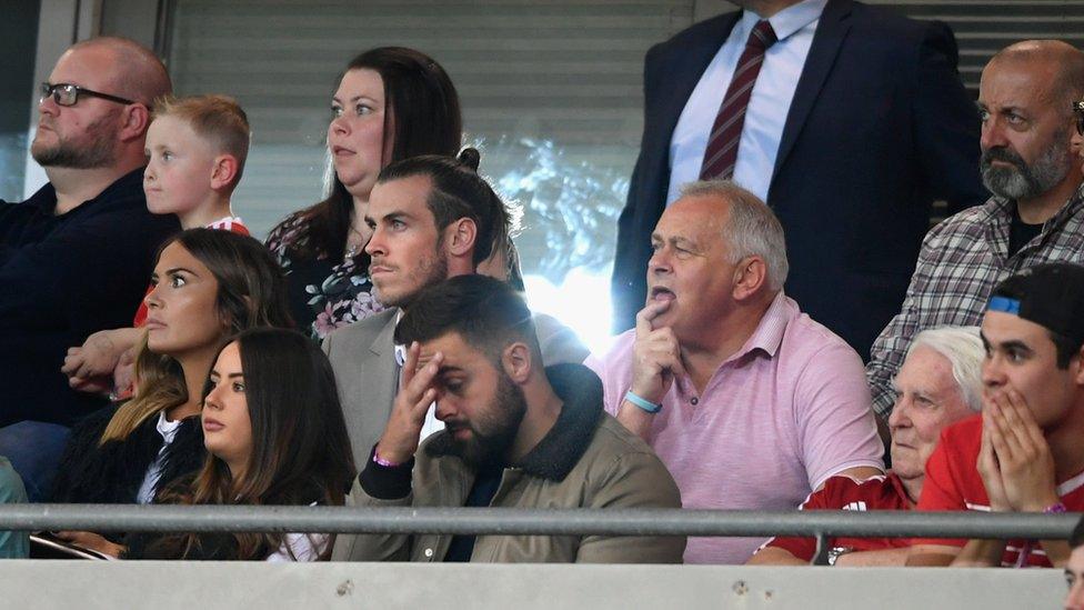 Gareth Bale looks on surrounded by concerned looking spectators at the Wales match against the Republic of Ireland.