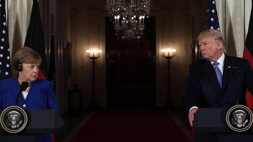 U.S. President Donald Trump (R) and German Chancellor Angela Merkel (L) participate in a joint news conference at the East Room of the White House