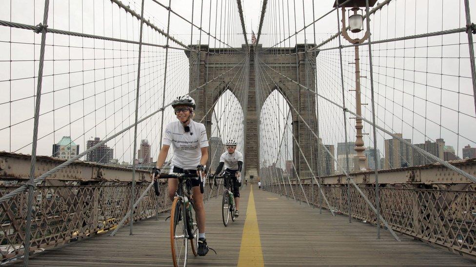 Jane Tomlinson (L) of Leeds, Great Britain, 42, rides on Brooklyn Bridge September 1, 2006 in New York.