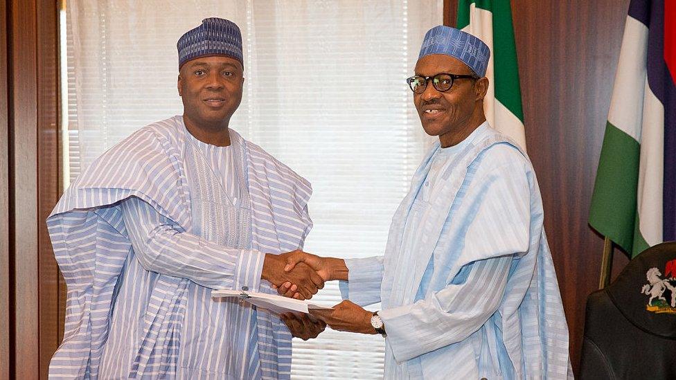 Senate President Bukola Saraki (L) is said to be behind President Buhari's (R) troubles