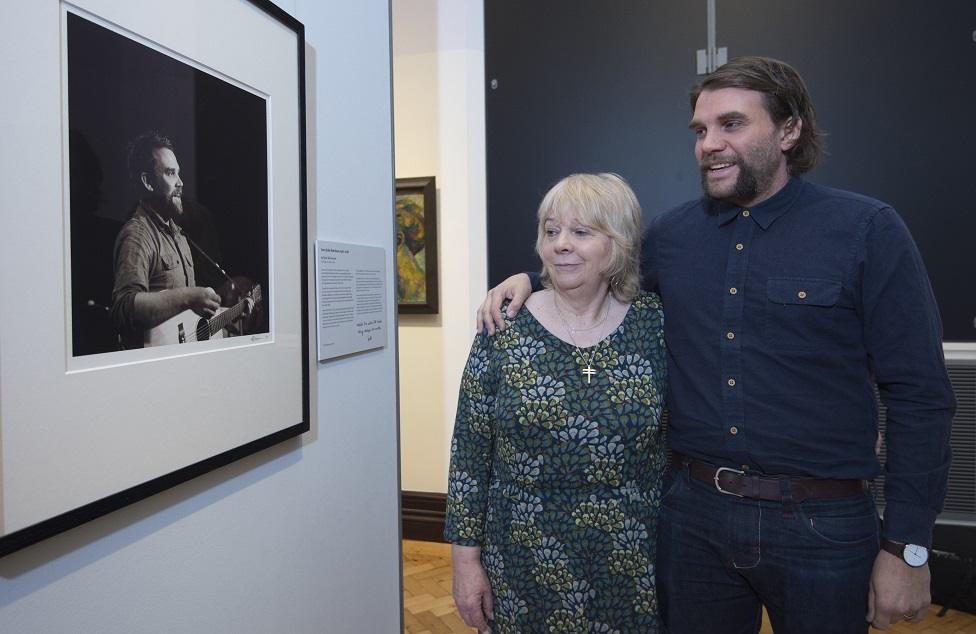 Marion and Grant Hutchison in front of the portrait of Scott