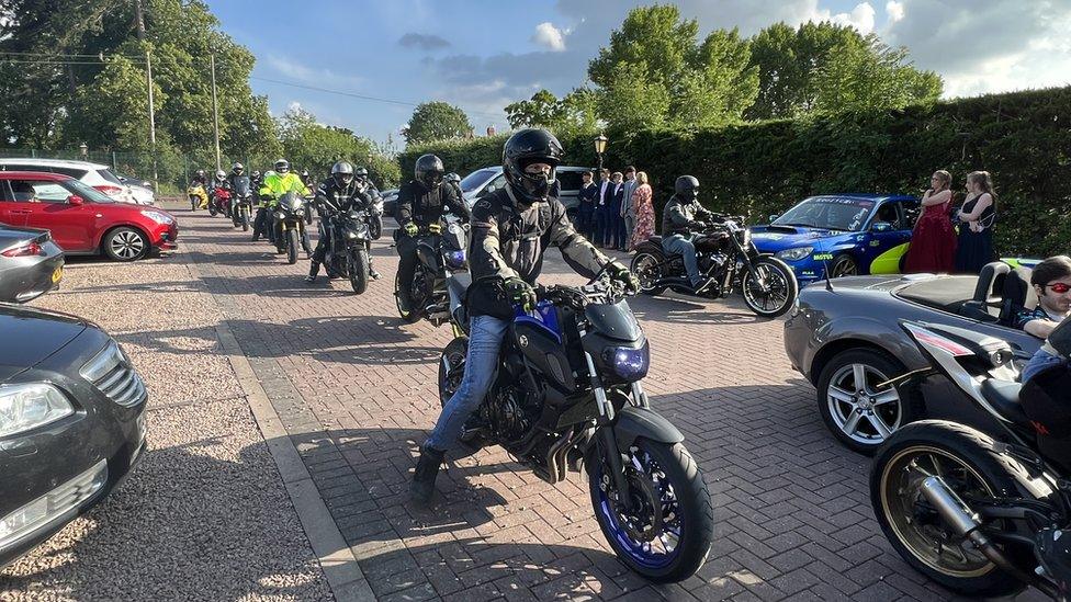 The convoy of motorbikes arriving at the venue