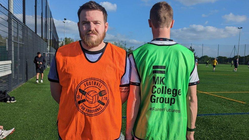 Football for Foodbanks orange vest