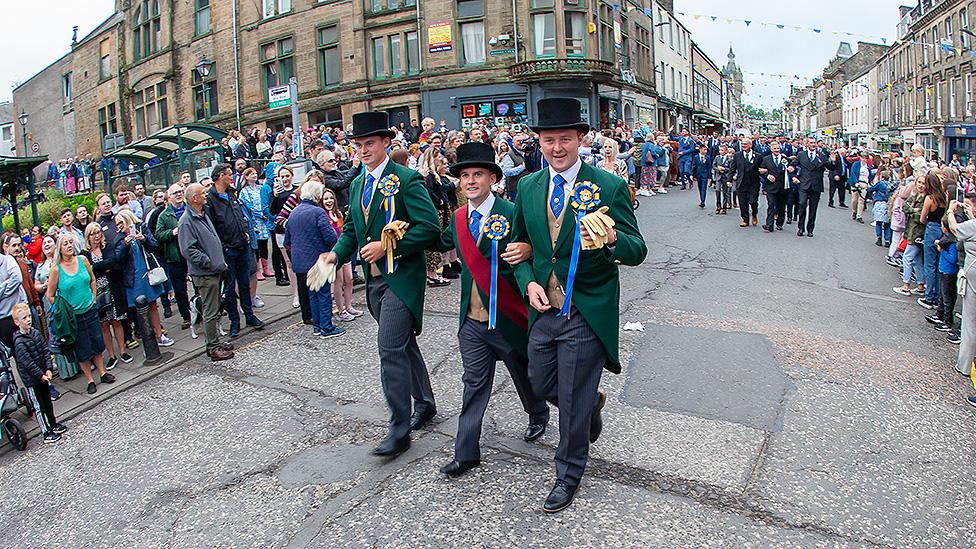 Cornet Greg Middlemass and left and right-hand men go from Town Hall to the horse monument