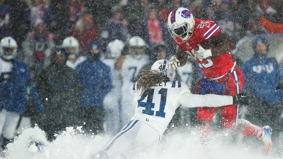 LeSean McCoy #25 of the Buffalo Bills runs the ball as Matthias Farley #41 of the Indianapolis Colts attempts to tackle him during overtime on December 10, 2017 at New Era Field in Orchard Park, New York.