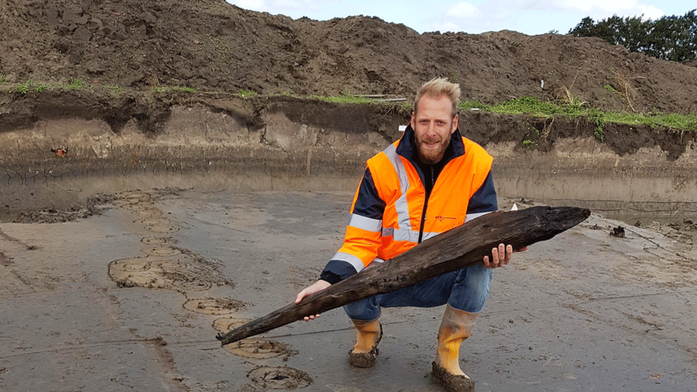 Dutch archaeologist Jeroen Loopik with a Roman oak pile, Katwijk, 2018