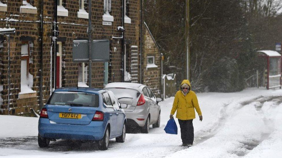 Woman walking in snow