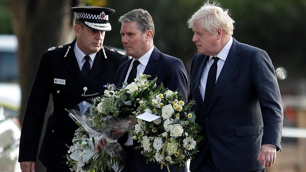 Chief Constable of Essex Police B. J. Harrington, Britain"s Labour Party leader Keir Starmer and Prime Minister Boris Johnson arrive to pay tribute at the scene where British MP David Amess was stabbed to death