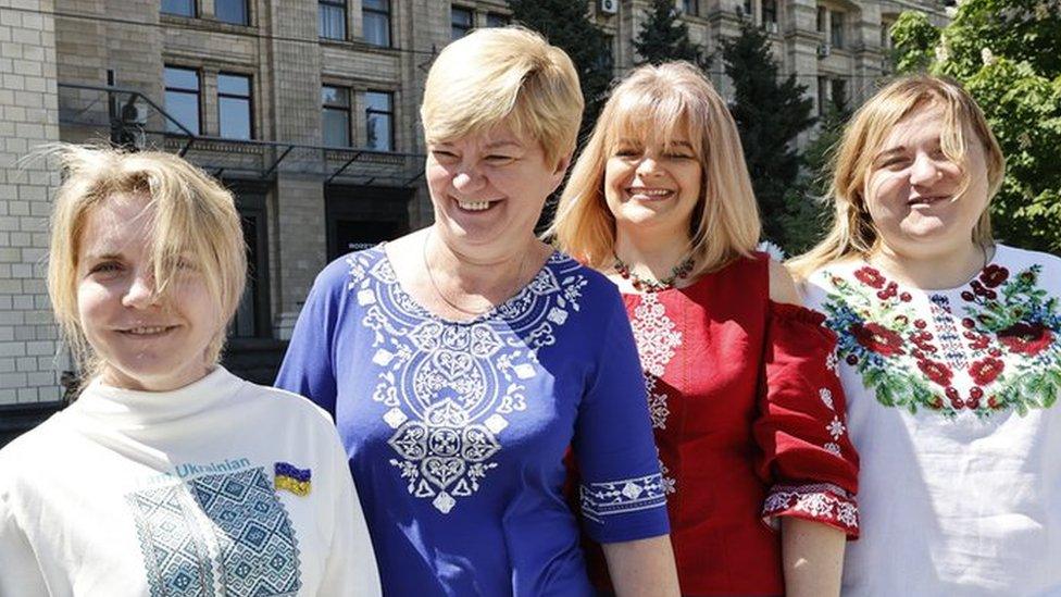 Women smiling at the camera