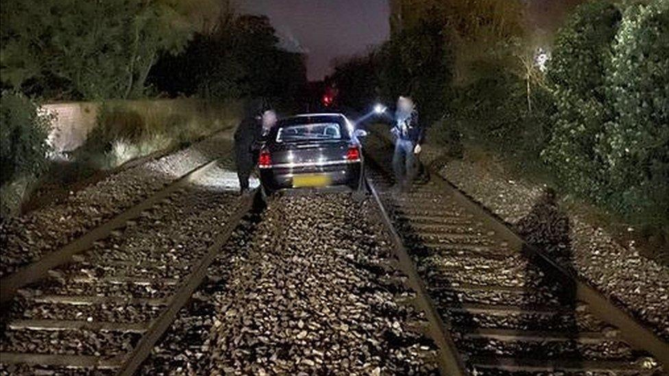 Car on railway line