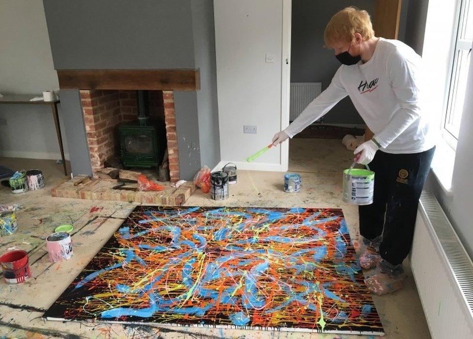 Ed Sheeran working on the painting Dab 2, which is up for auction for charity