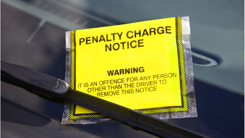 Penalty Charge Notic attached to windscreen of a car