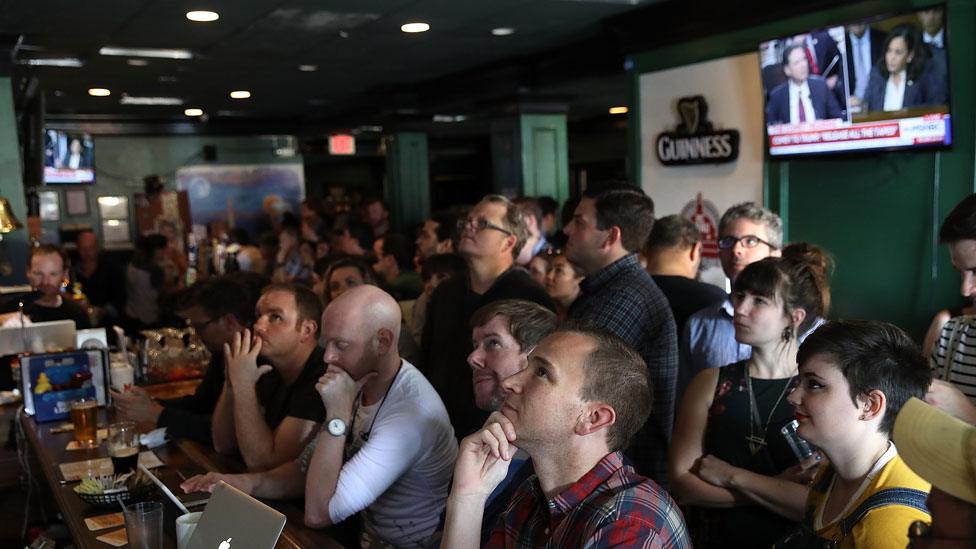 People in Washington bar watch Comey testimony