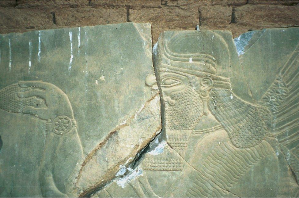 A relief split into parts by looters