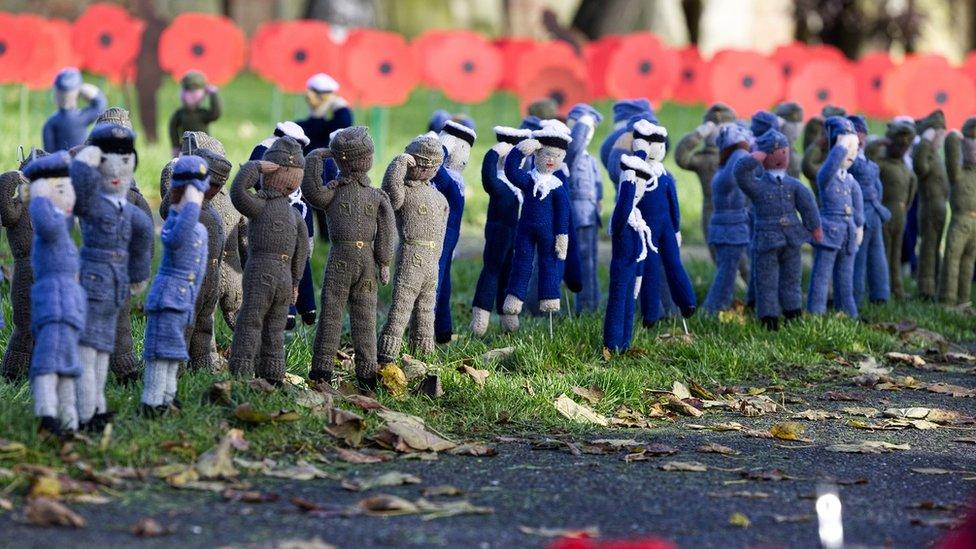 knitted soldiers in a row