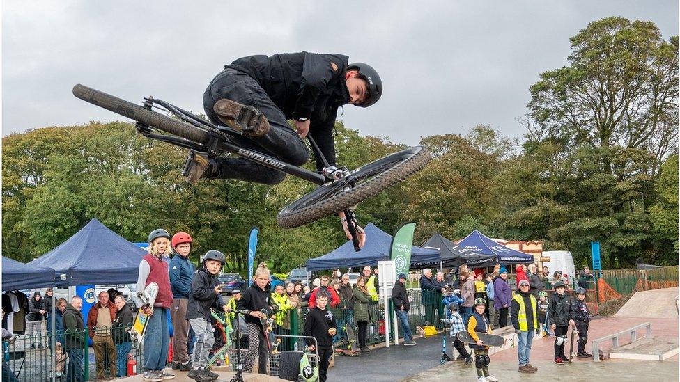 Man performing tricks on BMX at the new skate park