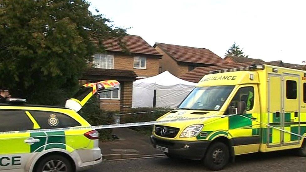 Police vehicles outside the house in Carnegie Gardens