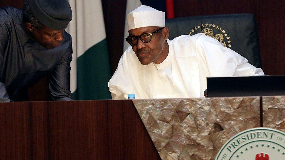 President Buhari is seen with Vice President Yemi Osinbajo during the federal executive council meeting in Abuja, Nigeria March 22, 2017