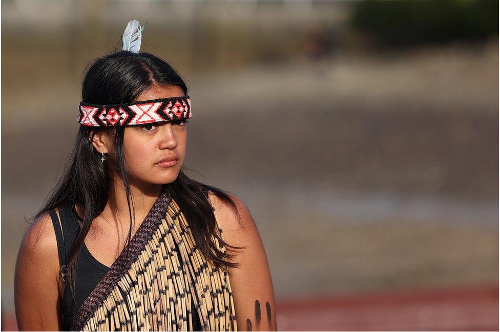 A girl waits to board the waka at the waka camp on February 06, 2021 in Waitangi, New Zealand.