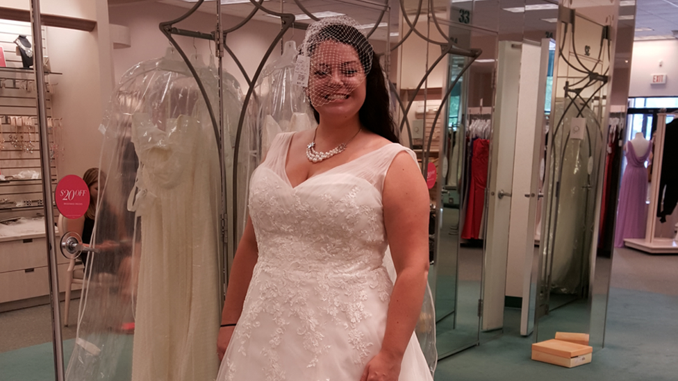 woman standing in wedding dress