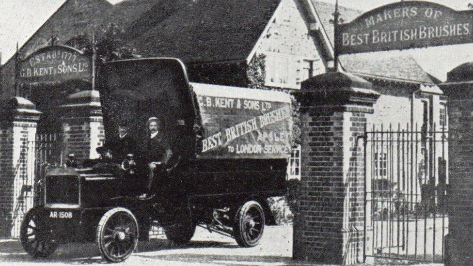 A picture from 1908 of a lorry exiting the gates of the Kent Brushes factory