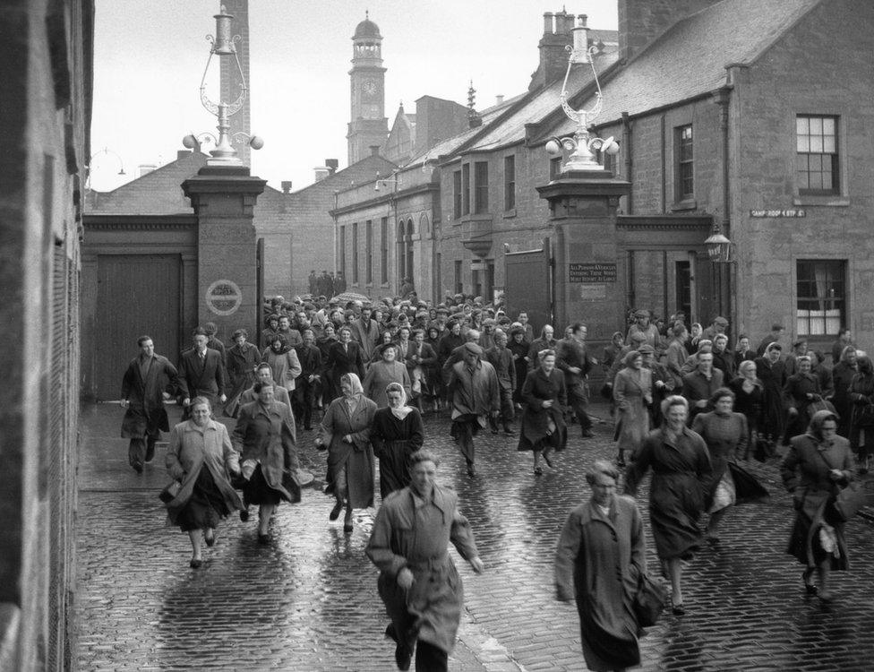 Workers leaving the mill in 1955