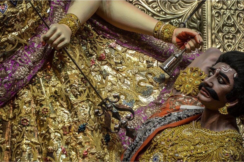 An idol of the Hindu goddess Durga in a sari made out of pure gold