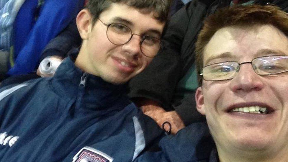 Karl Butler (right) with a friend at the Manchester United game