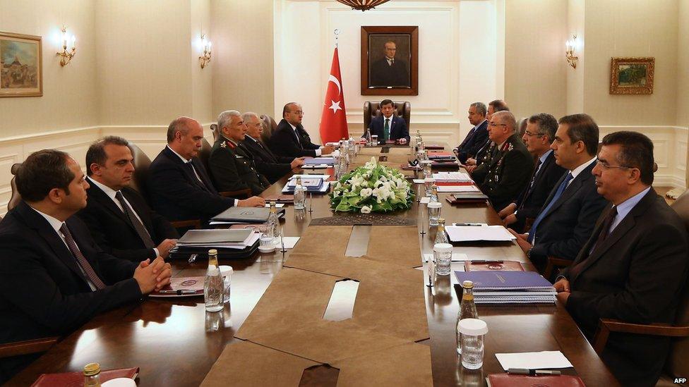 Turkey's Prime Minister Ahmet Davutoglu holds a security meeting