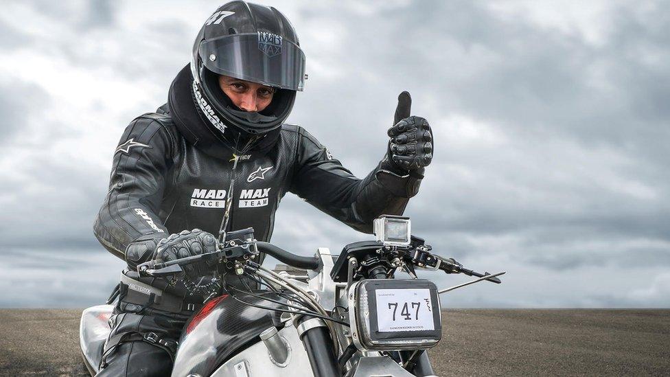 Zef Eisenberg on motorbike