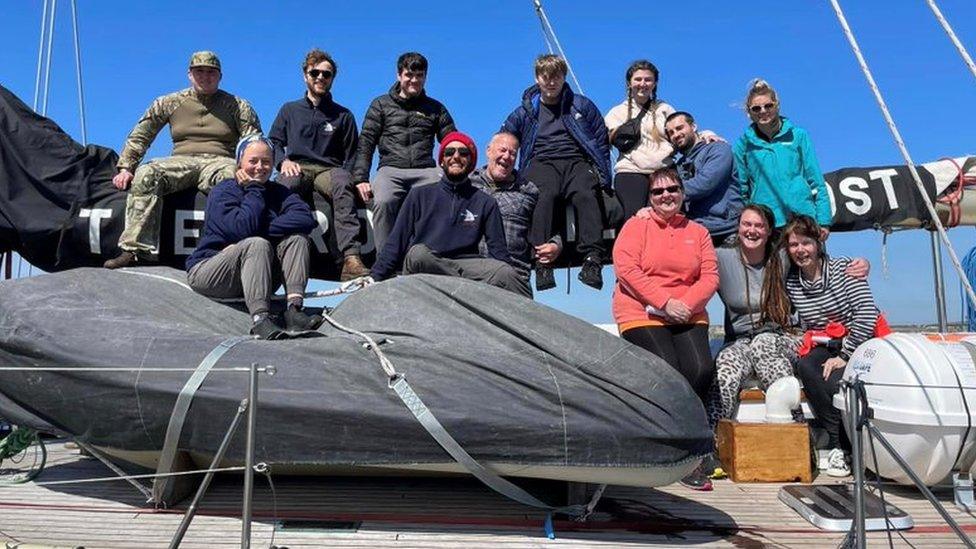 A group of sailors aboard a boat