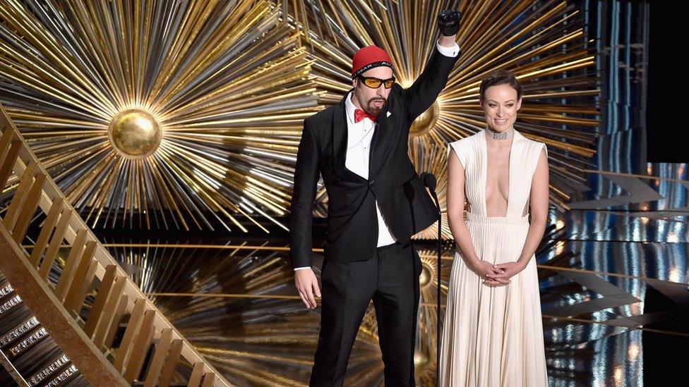 Sacha Baron Cohen as Ali G and Olivia Wilde