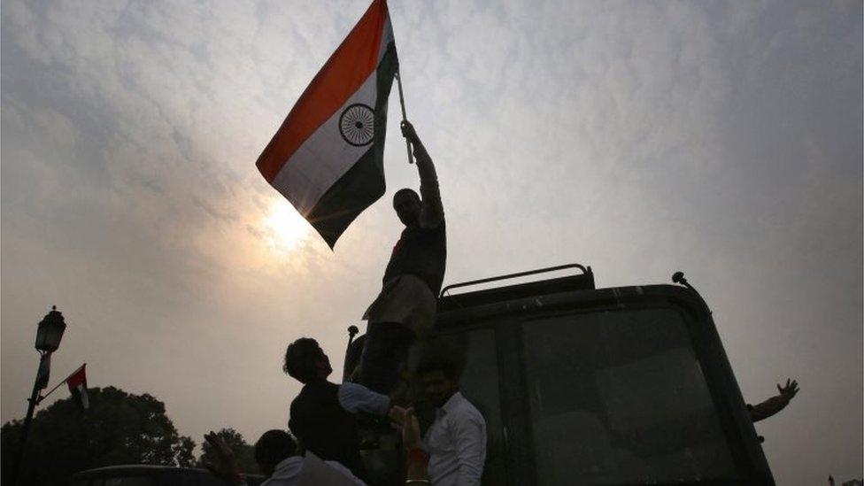 Indian student activists of the student organization Akhil Bharatiya Vidyarthi Parishad (ABVP) are detained by police personnel after a protest march at Rajpath against a group of Jawaharlal Nehru University (JNU) students