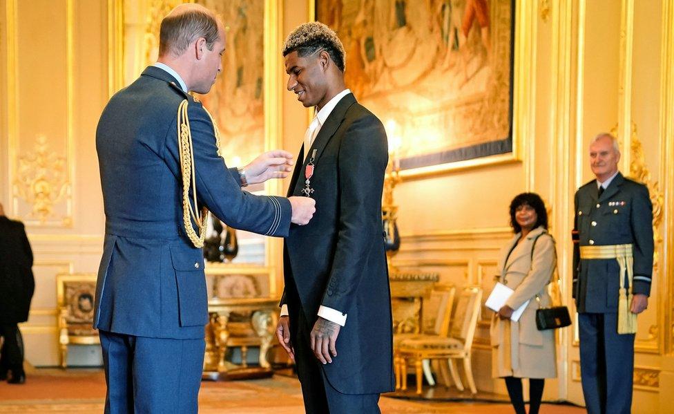 Marcus Rashford being made an MBE by Prince William