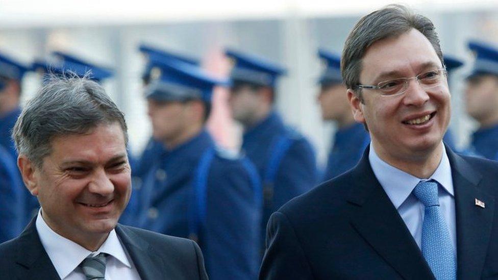 Serbia"s Prime Minister Aleksandar Vucic, right, accompanied by Bosnian Council of Ministers chairman Denis Zvizdic, left, inspect the honor guard, during an official welcoming ceremony in Sarajevo , Bosnia, Wednesday, Nov. 4, 2015.