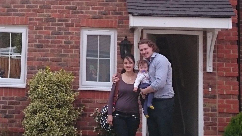 James Lowrey-English and his wife Jessica outside their new home