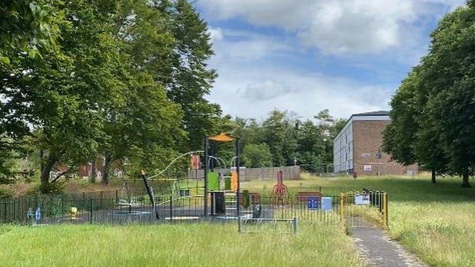 Bulford Camp park, a playground surrounded by trees