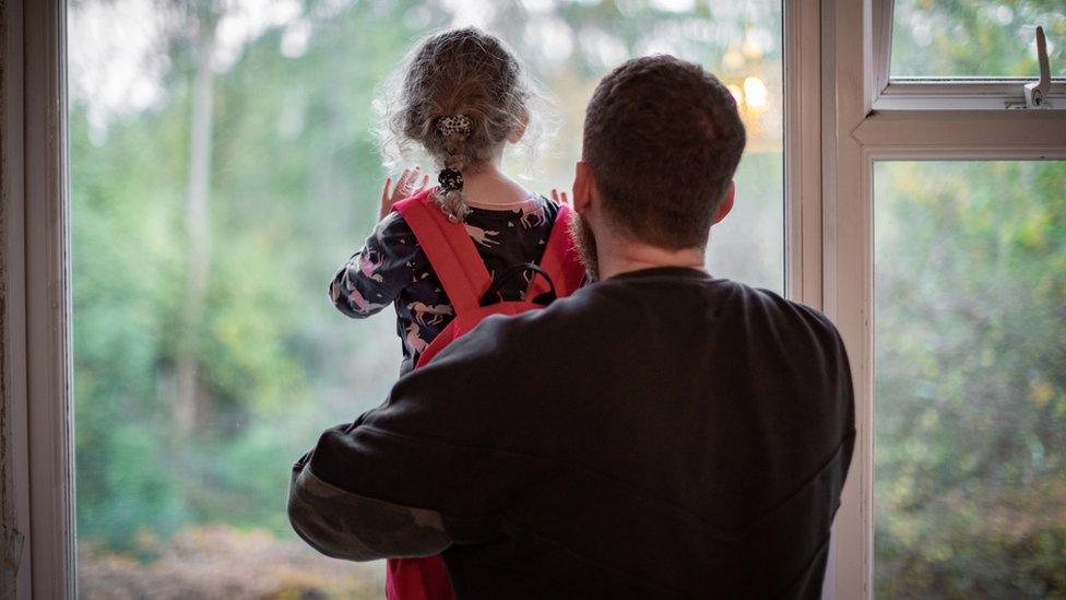 Father holding child