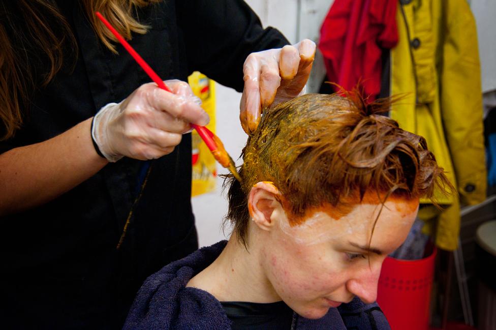 A woman having her hair coloured