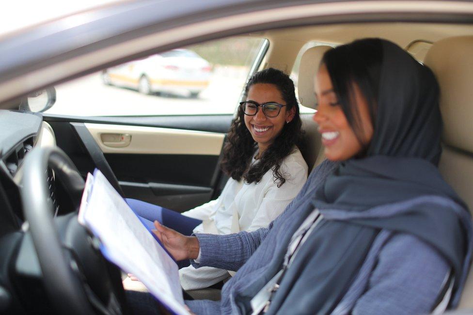 Student Maria al-Faraj with driving instructor Ahlam al-Somali