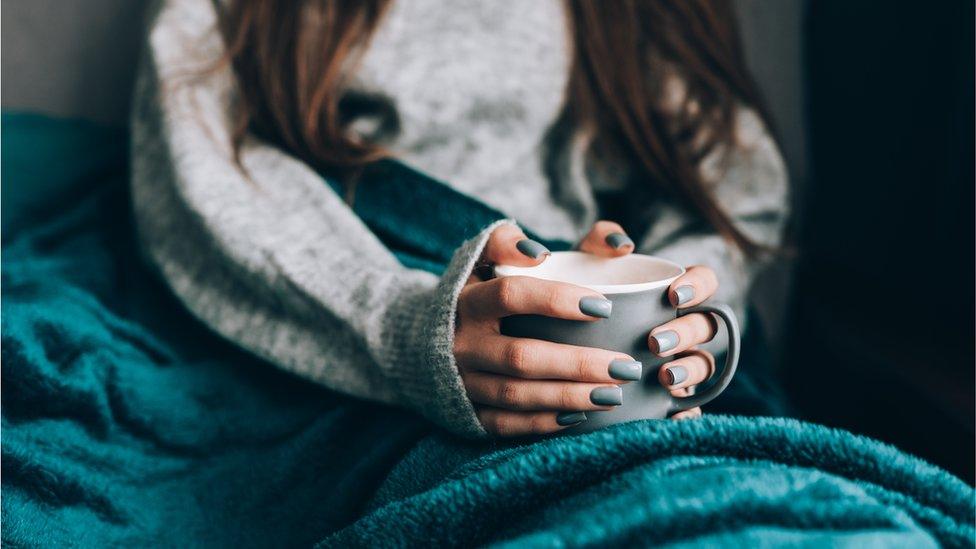 Woman with mug - stock shot