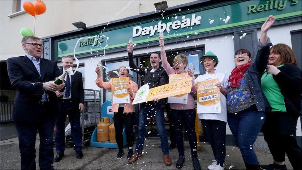 Staff at Reilly's Daybreak in Naul, where the winning ticket was sold, celebrate the family's big win