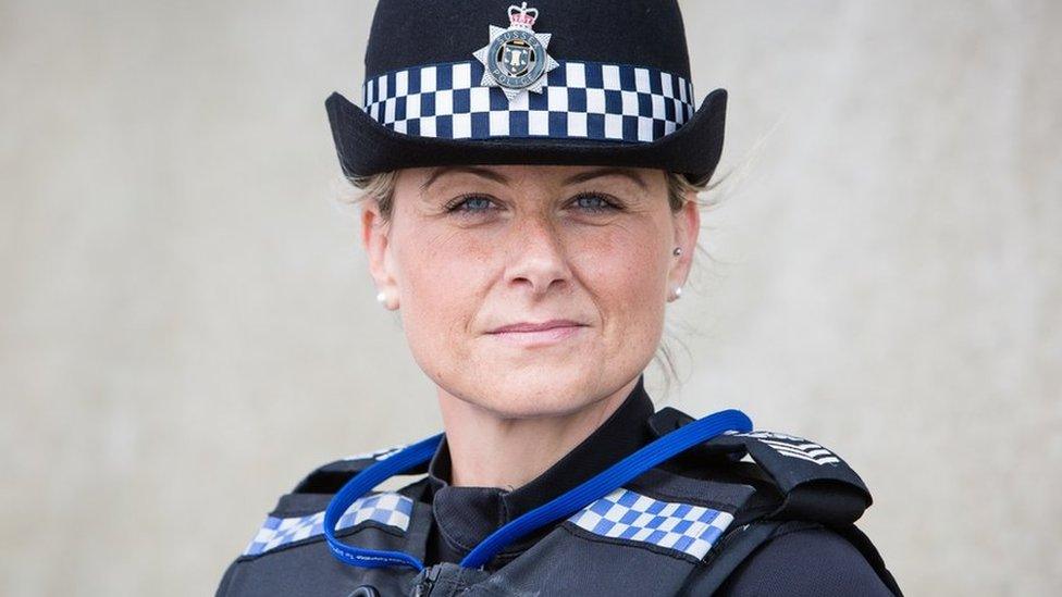 A picture of Sgt Suzie Randall in her black police uniform and hat.