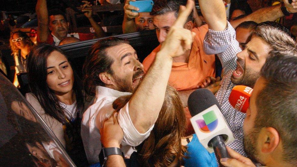 former san cristobal mayor Daniel Ceballos greets supporters after his release