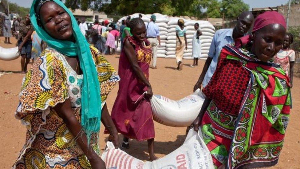 Women in South Sudan receive food aid