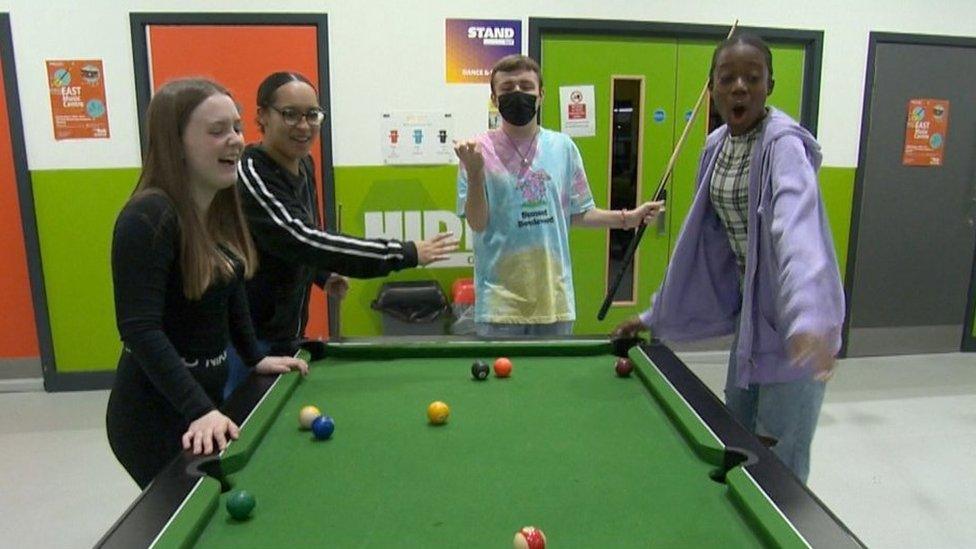 Young people playing pool